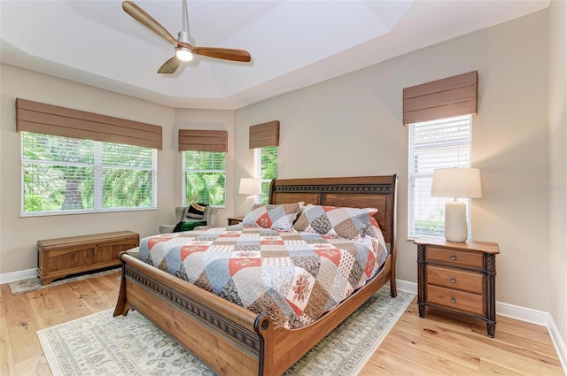 bedroom featuring light wood-type flooring and ceiling fan