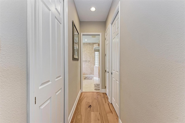 corridor featuring light wood-type flooring