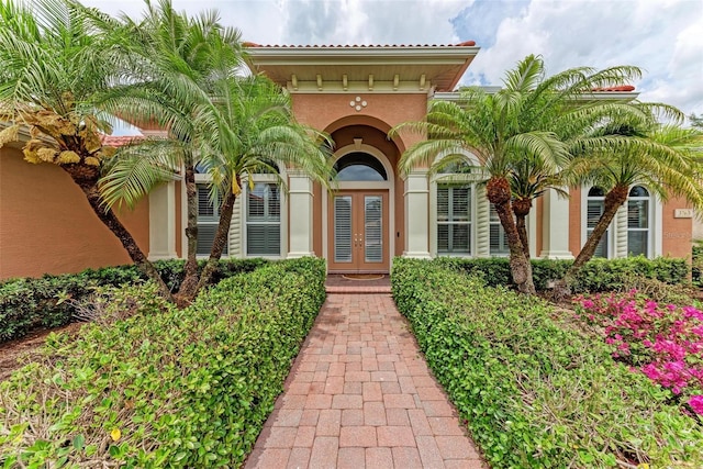 view of exterior entry featuring french doors