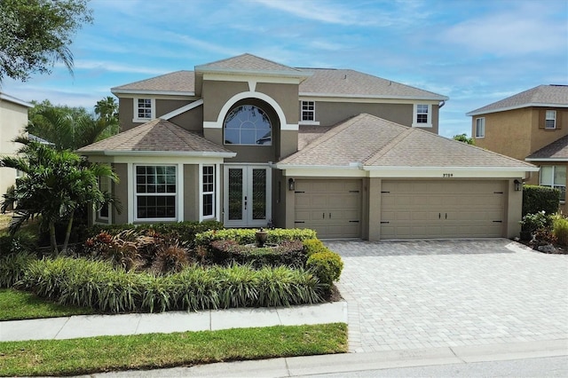 view of front of home featuring french doors and a garage