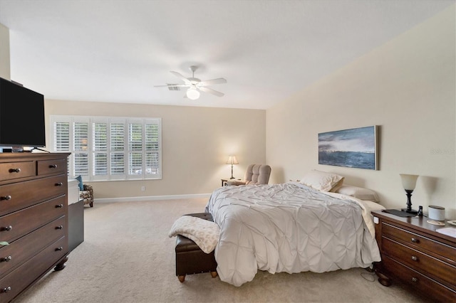 bedroom with ceiling fan and light colored carpet