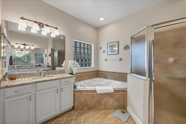 bathroom with separate shower and tub, tile patterned flooring, and vanity