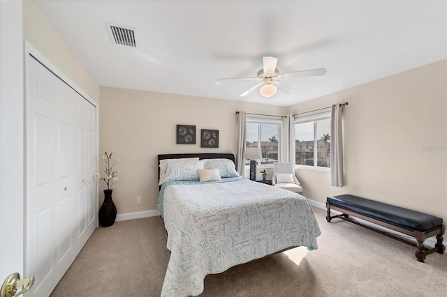 bedroom featuring ceiling fan, carpet floors, and a closet