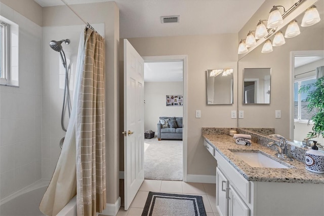 bathroom with tile patterned floors, vanity, a healthy amount of sunlight, and shower / bathtub combination with curtain