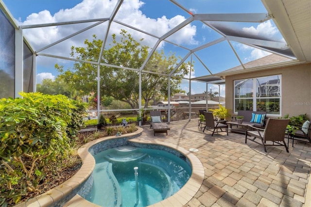 view of swimming pool featuring a patio area, outdoor lounge area, glass enclosure, and a hot tub