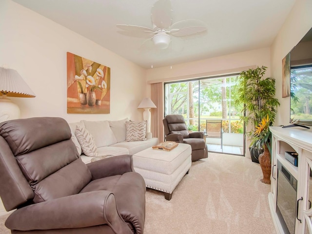 living room with light colored carpet and ceiling fan