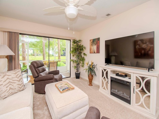 living room with ceiling fan and light carpet