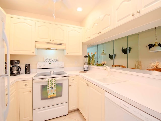 kitchen with white appliances, ceiling fan, white cabinets, sink, and light tile floors