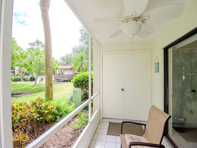 sunroom featuring plenty of natural light and ceiling fan