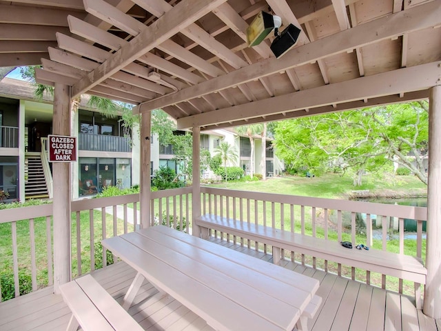 wooden terrace with a yard