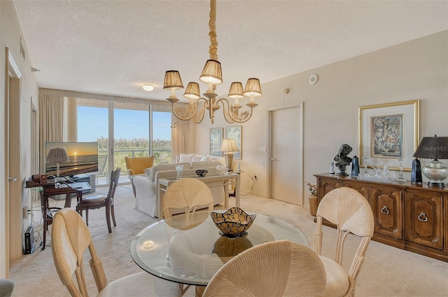 carpeted dining room featuring an inviting chandelier and a textured ceiling