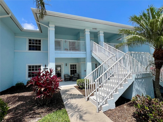 back of property with a patio