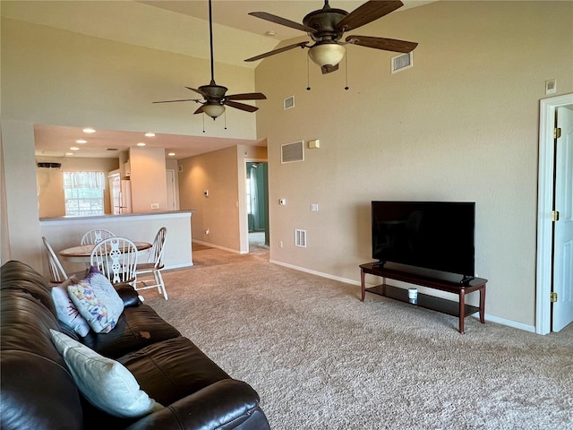 living room featuring ceiling fan, light colored carpet, and high vaulted ceiling