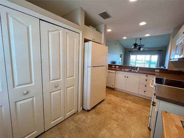 kitchen with white cabinets, ceiling fan, white appliances, and light tile floors