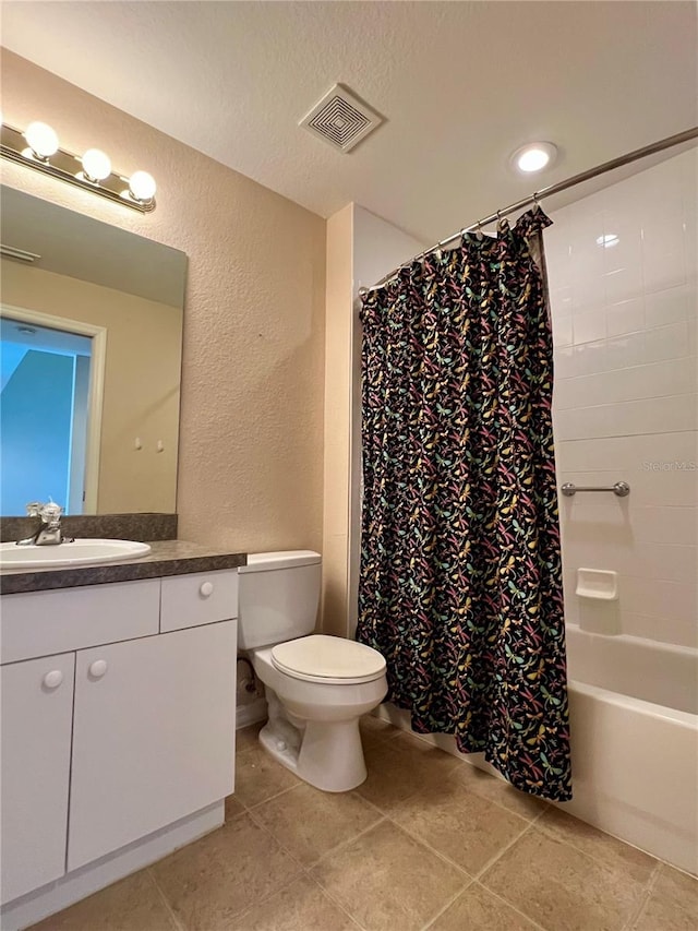 full bathroom featuring toilet, tile floors, shower / bathtub combination with curtain, and vanity