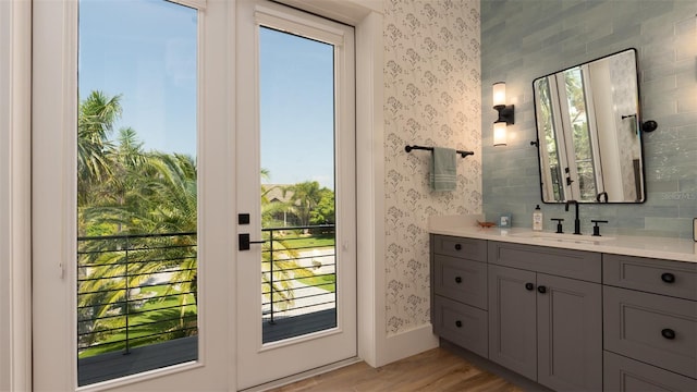 bathroom with vanity and wood-type flooring