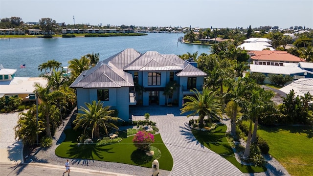 birds eye view of property featuring a water view