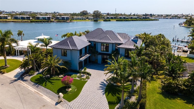 birds eye view of property featuring a water view