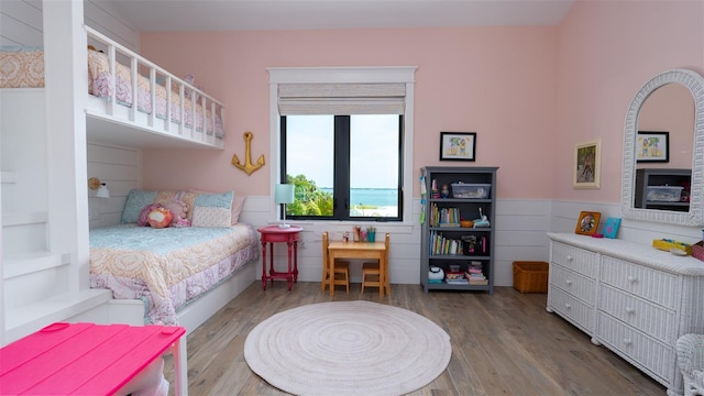 bedroom with wood-type flooring