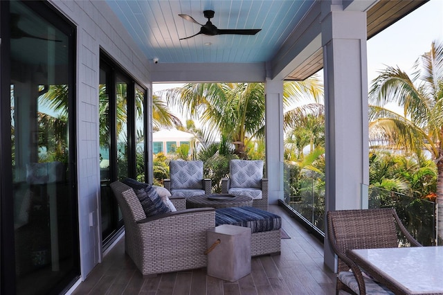 sunroom / solarium with ceiling fan