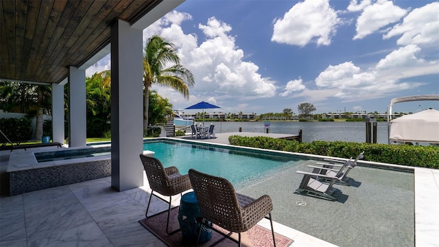 view of swimming pool with a water view, a patio, an in ground hot tub, and a dock