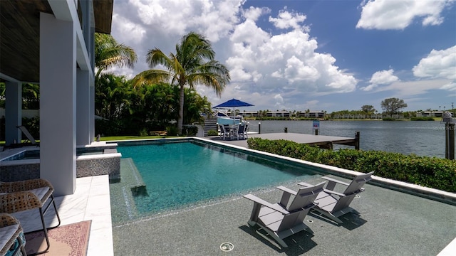 view of pool featuring a water view and a patio