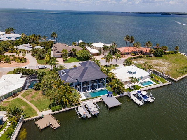 birds eye view of property featuring a water view