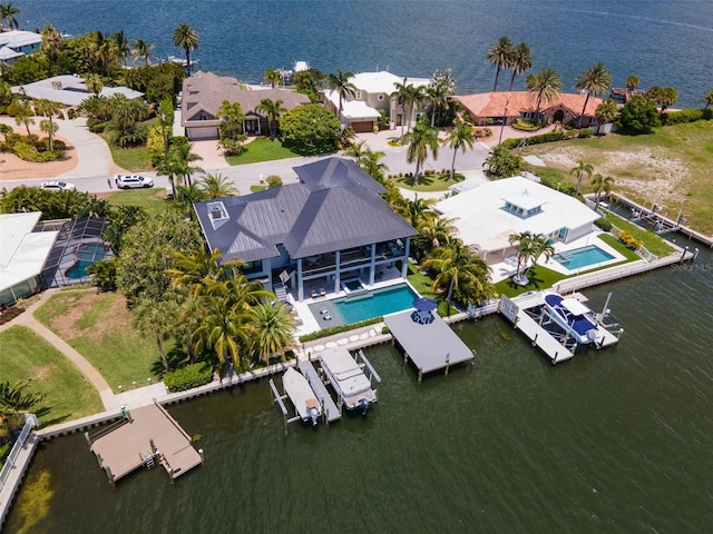 drone / aerial view with a water view