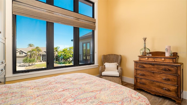 bedroom with hardwood / wood-style floors