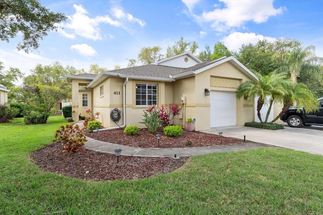 single story home featuring a garage and a front lawn