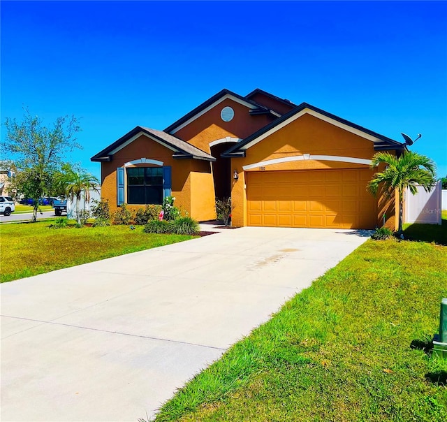 ranch-style home with a front lawn and a garage