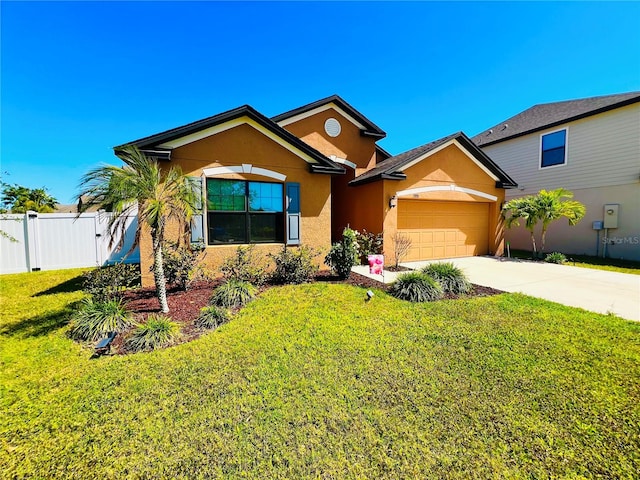 view of front of home with a front lawn and a garage