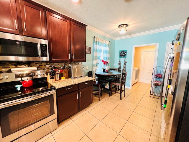 kitchen featuring ornamental molding, backsplash, appliances with stainless steel finishes, and light tile floors