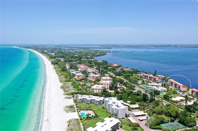 birds eye view of property featuring a view of the beach and a water view