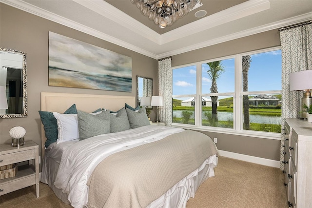 bedroom with carpet flooring, a water view, a raised ceiling, and ornamental molding