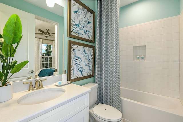 full bathroom with toilet, vanity, shower / tub combo with curtain, and ceiling fan