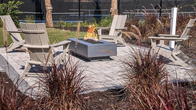 view of patio featuring an outdoor fire pit