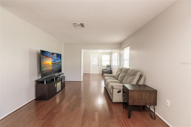 living room featuring dark hardwood / wood-style floors