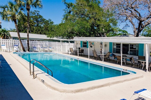 view of swimming pool featuring a patio area