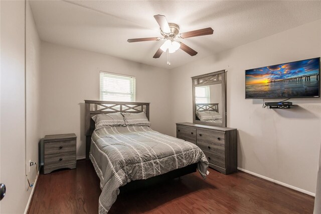 bedroom featuring ceiling fan and dark hardwood / wood-style floors