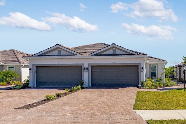 ranch-style home featuring a garage