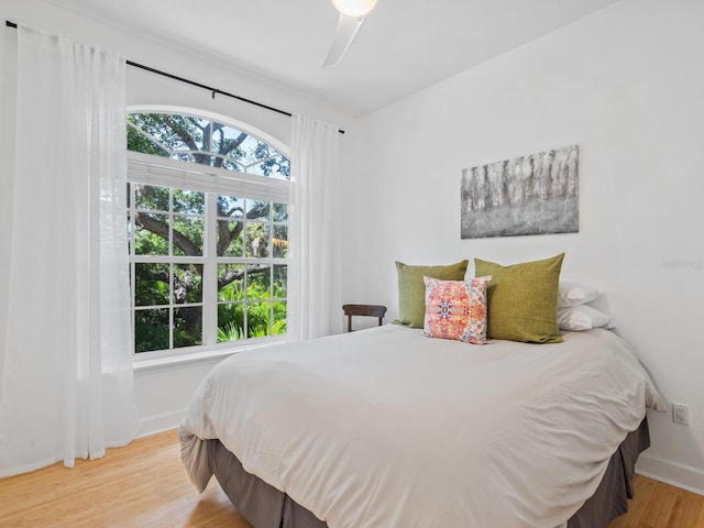 bedroom featuring ceiling fan and hardwood / wood-style floors