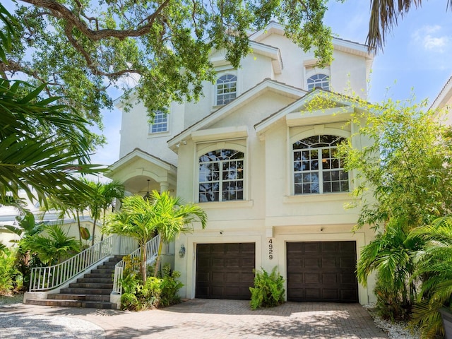 mediterranean / spanish house featuring a garage