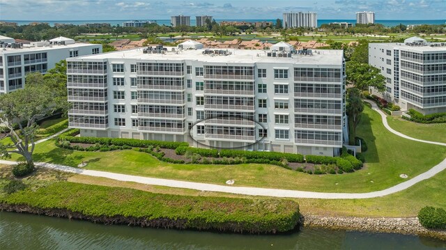 birds eye view of property with a water view