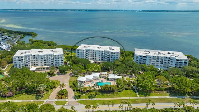 birds eye view of property with a water view