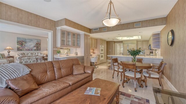 living room featuring light tile floors