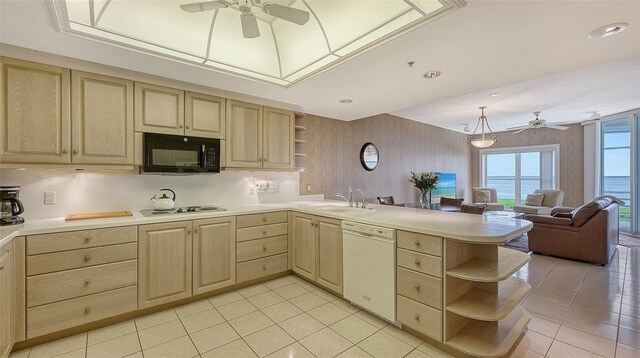 kitchen with light tile flooring, light brown cabinets, kitchen peninsula, dishwasher, and ceiling fan