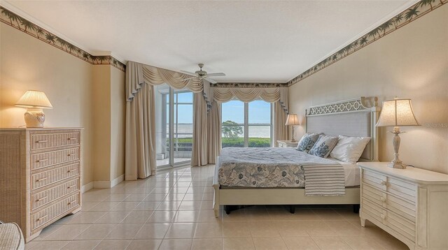 tiled bedroom featuring ceiling fan, crown molding, and access to outside