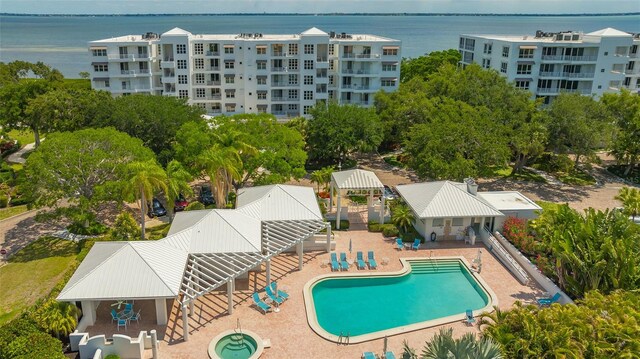 view of swimming pool featuring a water view and a gazebo