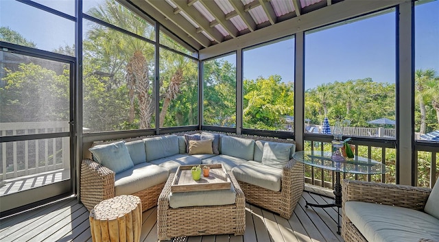 sunroom featuring lofted ceiling